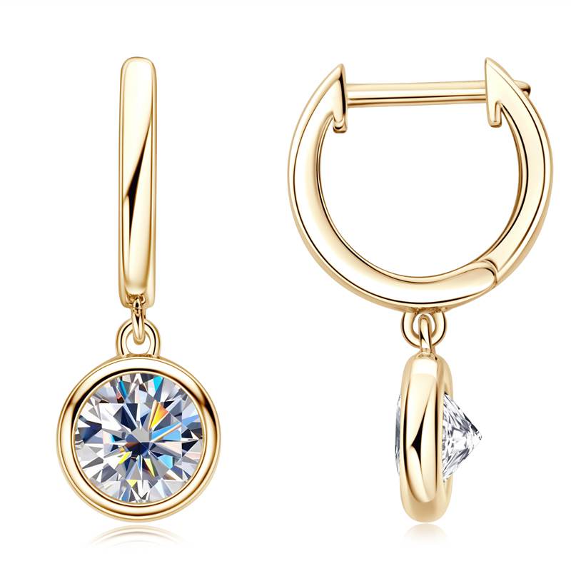 Gold hoop earrings with round and triangle cut gemstones on a white background