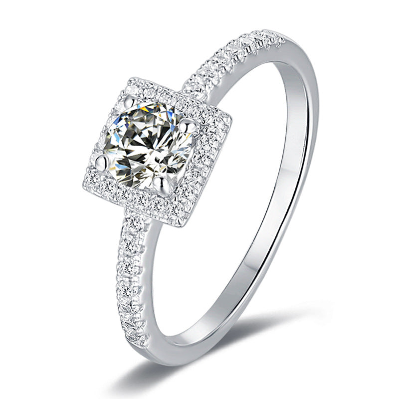 Princess cut halo moissanite ring with pave band in sterling silver.