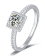 Princess cut halo moissanite ring with pave band in sterling silver.