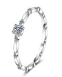 Single stone moissanite stacker ring in sterling silver.