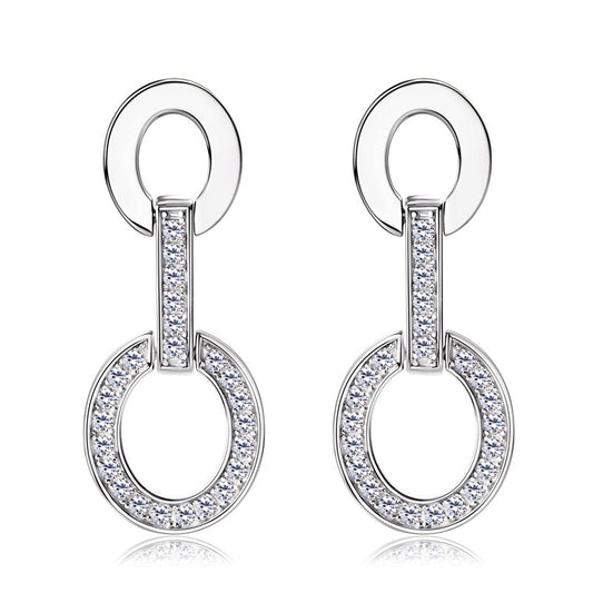 Pair of silver earrings with circular design and clear stones on a white background