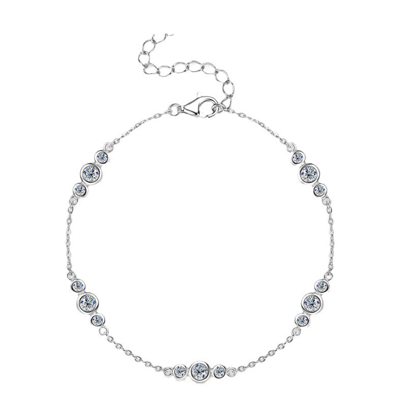 Silver bracelet with three trio clear moissanite gemstones on a white background