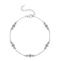 Silver bracelet with three trio clear moissanite gemstones on a white background