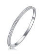 Silver bangle with pavé moissanite on a white background