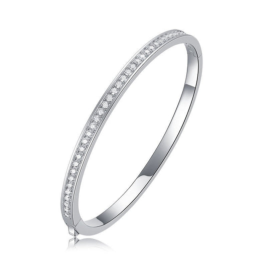 Silver bangle with pavé moissanite on a white background